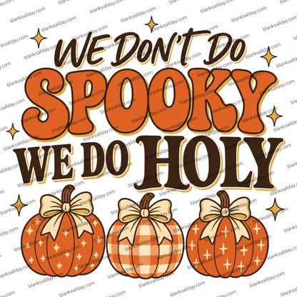 A digital graphic design featuring the text 'WE DON'T DO SPOOKY WE DO HOLY' in stylized brown and orange lettering, decorated with small gold stars. Below the text are three orange pumpkins with different patterns (stripes, gingham, and white crosses) tied with beige bows.