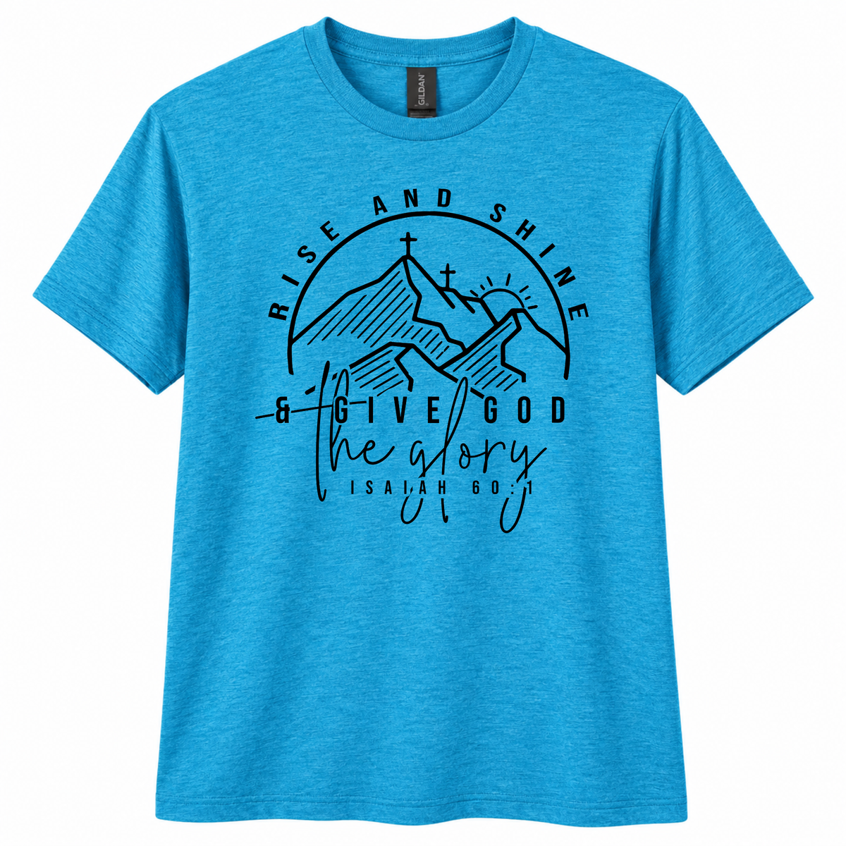 A heather blue short-sleeve crewneck t-shirt with a black graphic print on the front featuring mountains, crosses, and the text 'RISE AND SHINE & GIVE GOD the glory ISAIAH 40:31'.
